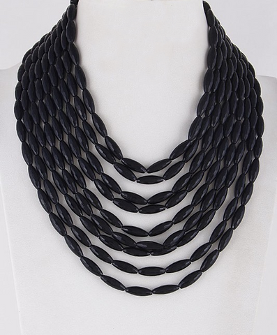 Shiny black plastic beads on 9 graduated strands (17" - 24") necklace