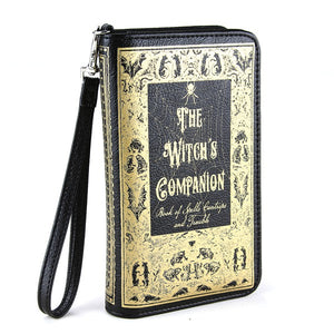 7" textured black with metallic gold print book-shaped "The Witch's Companion" wristlet strap wallet