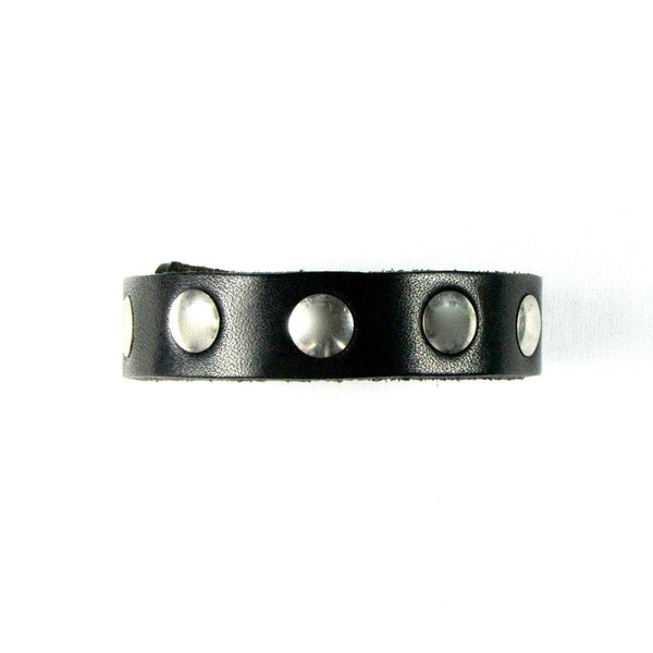thick leather 1/2” wide adjustable studded cuff with a single row of 3/8" round silver metal rivets and heavy duty snap closure. Shown from the side and done up