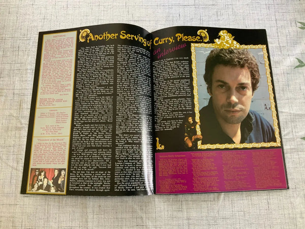 Inside of Rocky Horror official poster magazine showing interview with Tim Curry