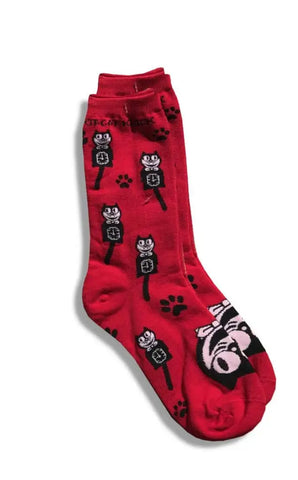 Red crew socks with a black and white Kit-Cat Klock and black paw print pattern. There is a cat face on the top of each foot and the words “KIT-CAT KLOCK” on each ankle