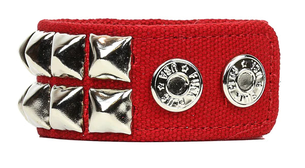thick classic red canvas wristband with 2 rows of silver metal pyramid studs and a double heavy duty snap closure. 