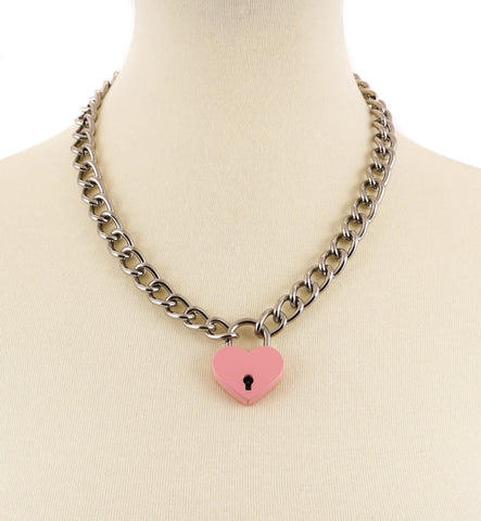 20” silver metal link chain with a 1” heart-shaped padlock in a shiny light pink finish. Key on a split key ring is attached to the lock for opening and closing the padlock