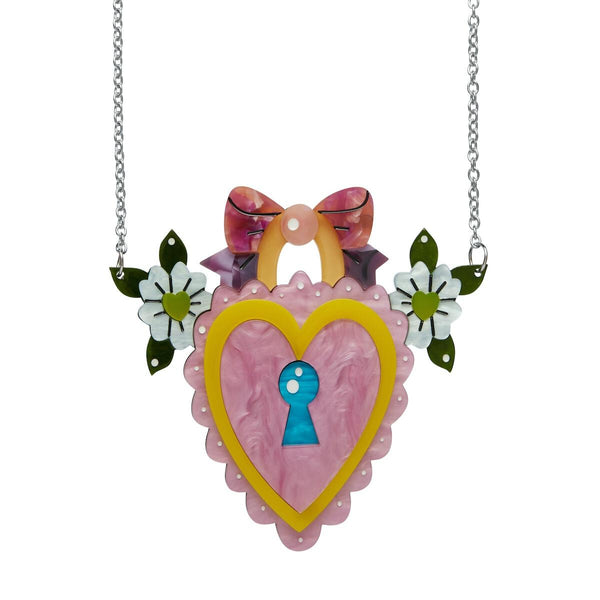 "Key to Your Heart" pink heart-shaped lock flanked by flowers and topped with a bow layered resin pendant on silver metal chain statement necklace