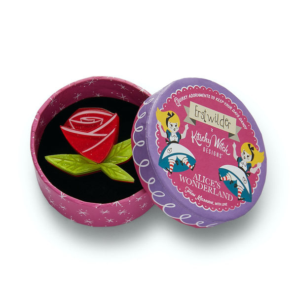 red rose with green leaves layered glitter resin brooch, shown in illustrated round box packaging