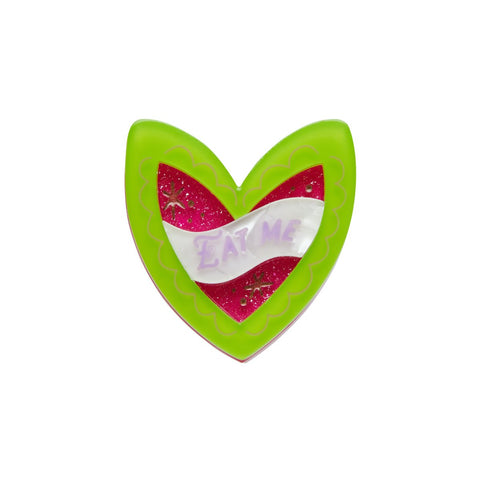 green and hot pink heart-shaped cake with white "EAT ME" banner label layered resin brooch