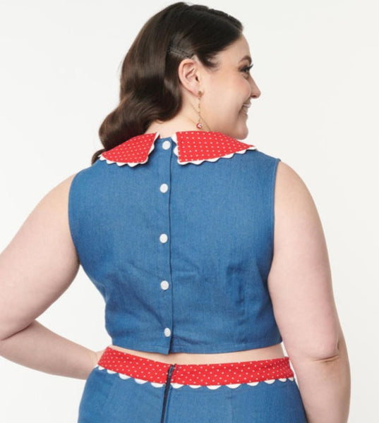 retro style shell top in stretch faux denim with a red and white dotted collar and white ric rac trim detail, showing button up back view on model