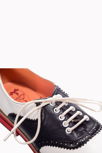 Close up shot of lace up detail on shoes