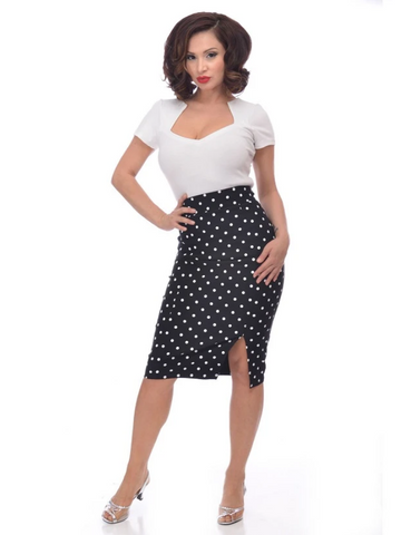 black with white polka dots high-waisted stretchy pencil skirt with front slit, shown on model