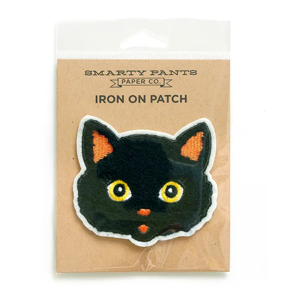 A patch of a black cat on brown cardboard packaging. The words “Smarty Pants Paper Co.” is printed on the cardboard