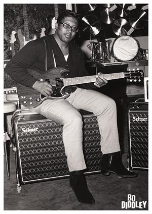 Bo Diddley sitting on amp with guitar 23.5" x 33" black & white photo image poster