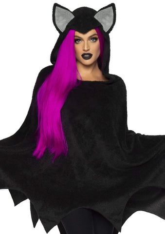 fuzzy-plush black poncho featuring a batty scalloped bottom hem and ear topped hood with pointed front, shown on model wearing long purple wig