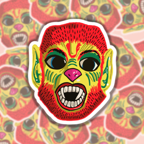 Die cut sticker of a vintage style werewolf Halloween mask in bright colors