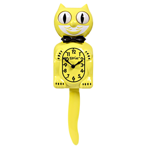 Bright yellow and white Kit-Cat wall mount clock features a mischievous grin, and big round eyes that swivel side-to-side in time with its pendulum tail