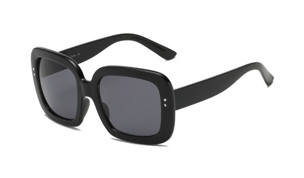 Oversized sunglasses with thick square frames and small rhinestone detailing at each temple. Shown from the side to display the arms