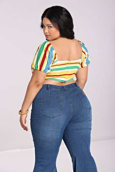 A plus size model wearing a short sleeved crop top with horizontal stripes in white, red, light blue, yellow, and seafoam green. It has a fitted bodice with tie detail and elasticized sweetheart neckline. Shown from behind to feature the zip back closure