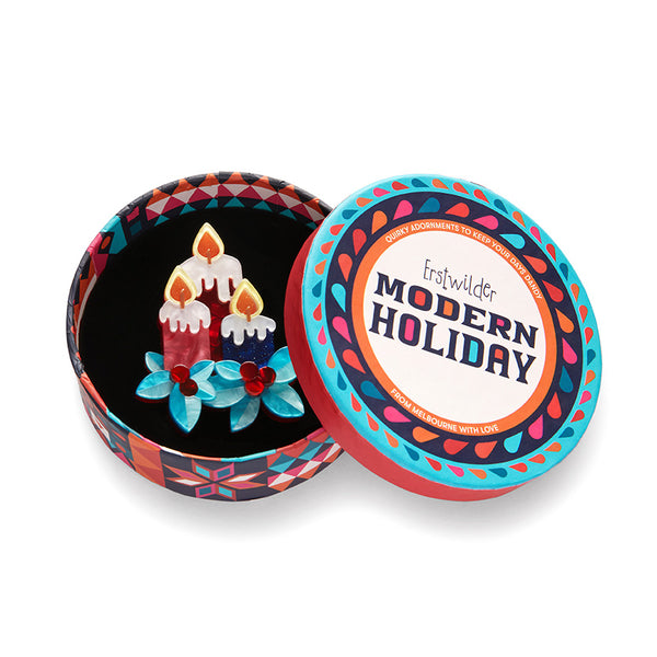 Modern Holiday Collection "Bright Spirits" layered resin three-candle decoration brooch, shown in illustrated round box packaging