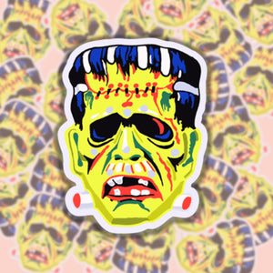 Die cut vinyl sticker of a vintage style Frankenstein Halloween mask in bright neon colors 