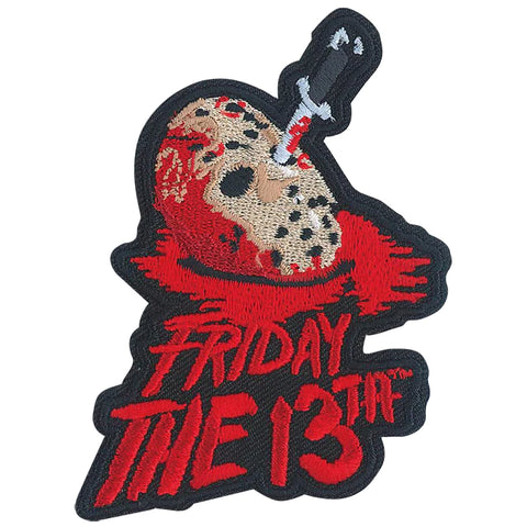 An embroidered red, black, and beige patch of the logo for the 1980 horror classic ﻿Friday The 13th ﻿with main slasher Jason’s mask impaled by a knife
