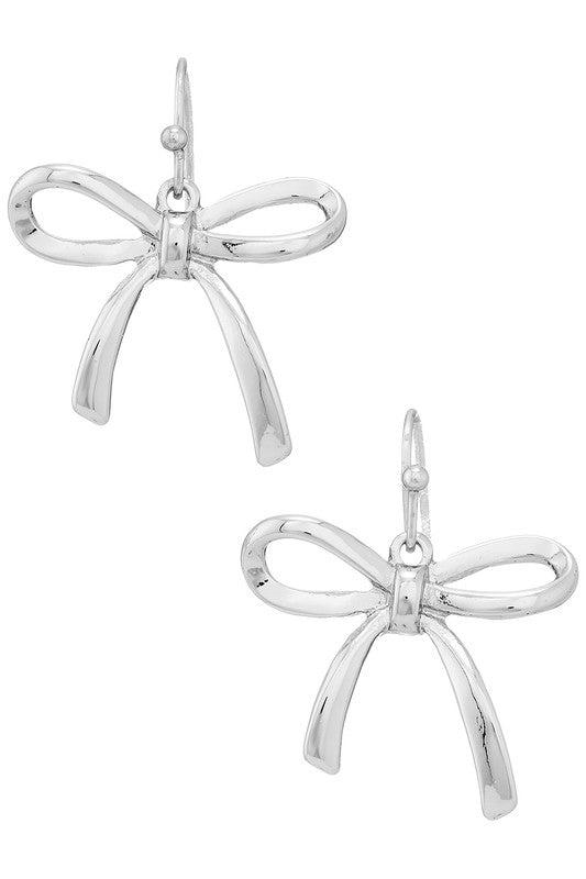 Dainty bow drop earrings in shiny silver metal.