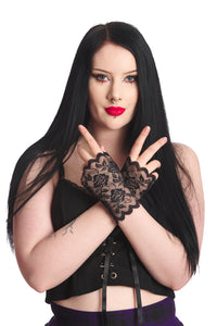 A model wearing a pair of wrist length black floral lace fingerless gloves 