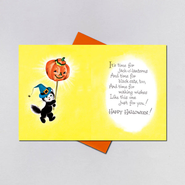 The inside of the card showing the kitten carrying the jack-o’-lantern on a stick on the left with the message “ It’s time for jack-o’-lanterns and time for black cats, too, and time for making wishes like this one just for you! Happy Halloween!”
