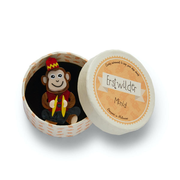 toy seated brown chimpanzee with cymbals wearing red fez and vest 2 1/4" layered resin brooch, shown in illustrated Erstwilder round giftbox