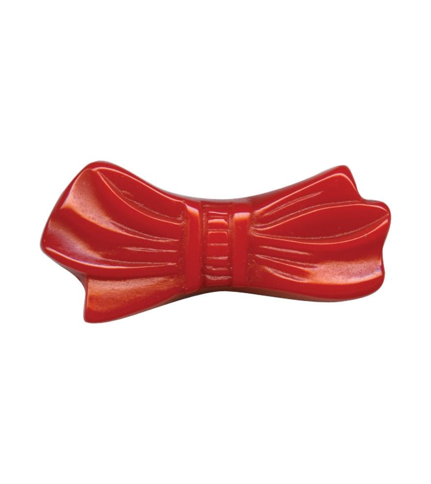 red polyresin 1 7/8" x 7/8" bow shaped hair accessory on 1 1/4" pinch-release barrette