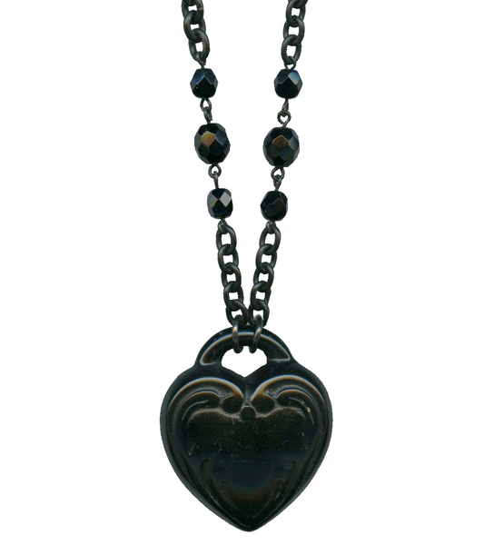 1 5/8" black heart retrolite pendant on 17" black metal chain with faceted black glass beads, close-up