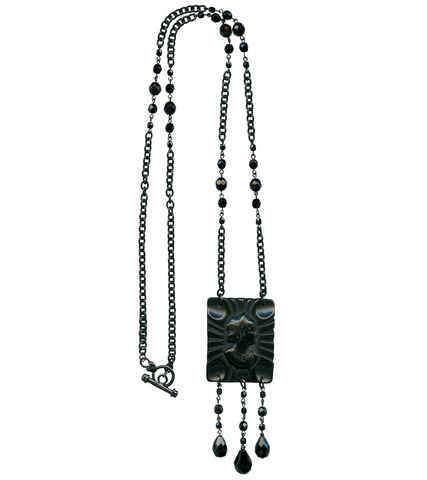black Retrolite resin cameo pendant with faceted black glass beads drops on 34" long black metal and glass bead chain