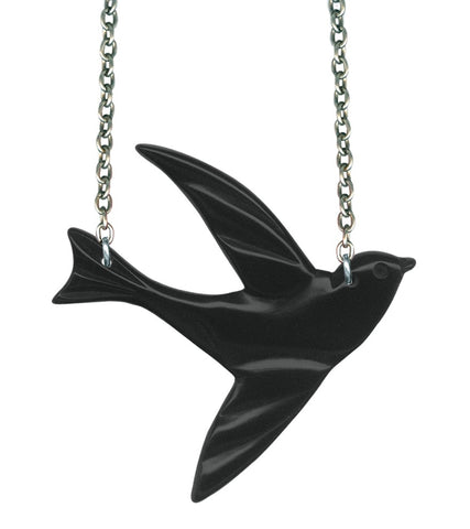 A black resin charm in the style of Bakelite of a swallow hung on 16” silver metal chain