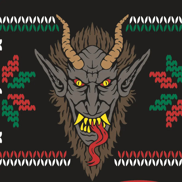 Fair Isle style pattern in red and green of holly and Christmas trees with an illustration of Krampus on soft black stretch cotton blend crew socks. Close up of Krampus illustration 