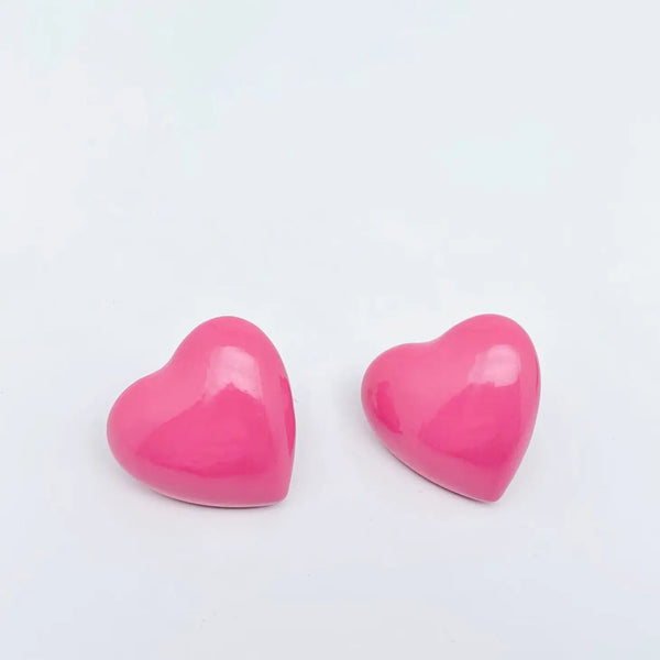 shiny pink enameled metal heart-shaped post earrings
