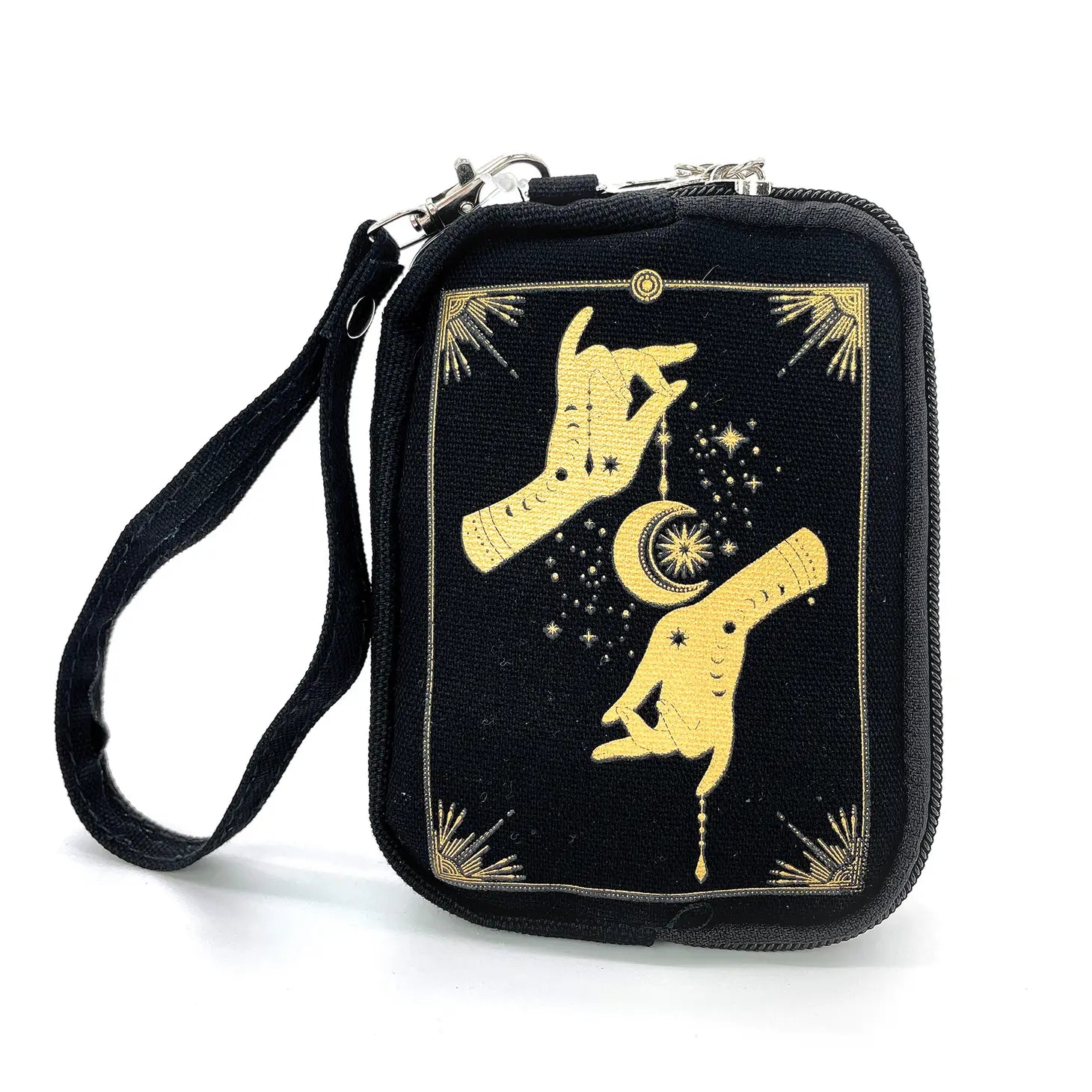 Black canvas rectangular pouch printed with a metallic gold design of a pair of hands and crescent moon surrounded by a celestial design and an Art Deco style rectangular border. Has two zipper closure compartments, and detachable wristlet strap. Front with design shown