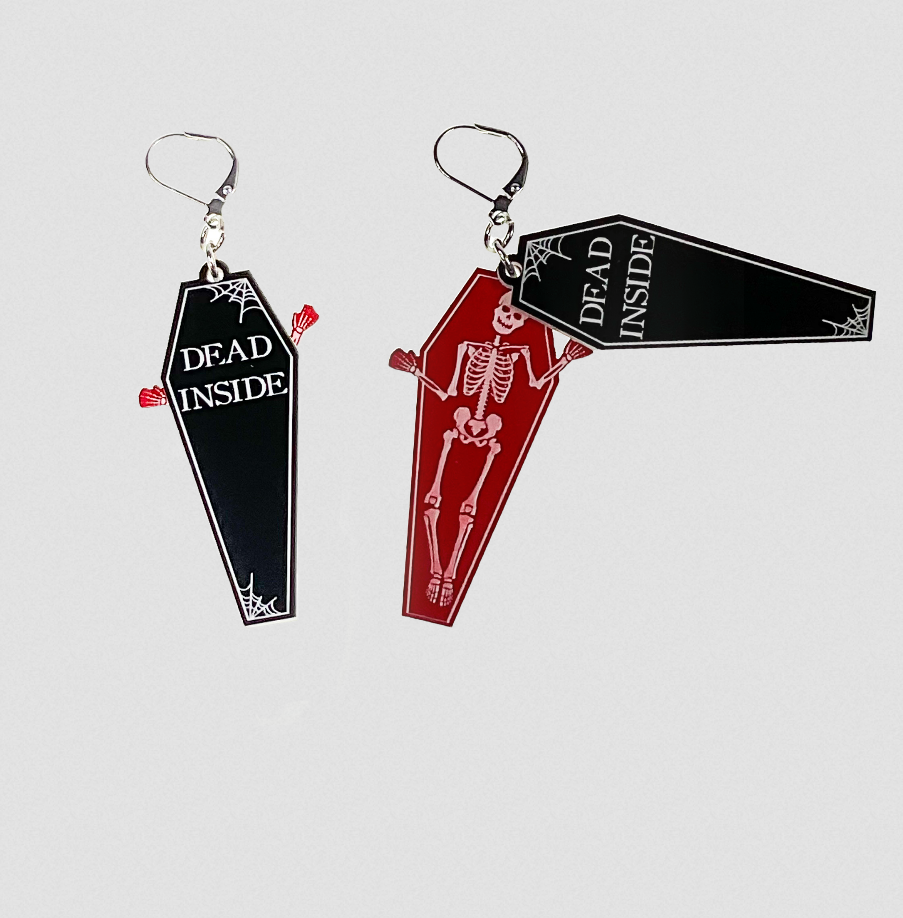 pair two-tone black and white laser cut acrylic "Dead Inside" coffin dangle earrings designed to swing open and reveal a skeleton-filled red interior bottom layer