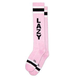 Baby pink knee socks with a black and white striped cuff and the word “LAZY” running vertically down the leg of each sock