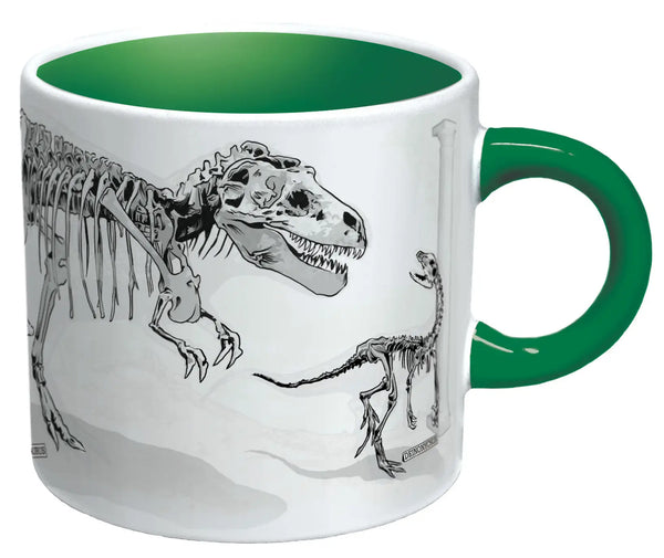 The ceramic mug after being exposed to hot liquid showing the dinosaurs having been turned into fossils