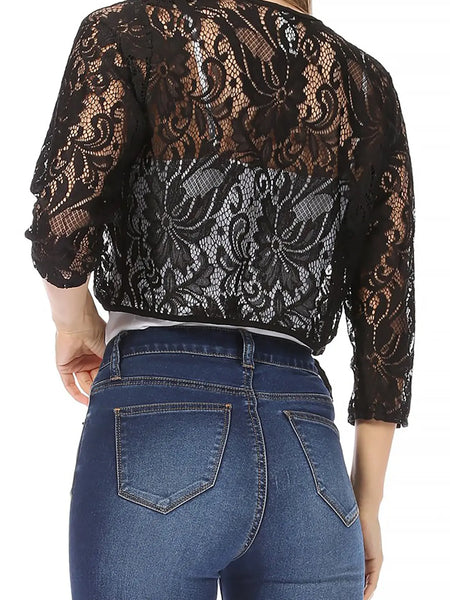black floral patterned lace 3/4 sleeve bolero with solid black trim worn by a model shown from the back 