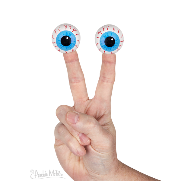 two 1 1/2" vinyl bloodshot blue iris eyeball finger puppets, shown on a hand