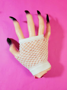 Wrist-length white fingerless fishnet glove, shown on halloween prop hand