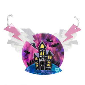 "Happy Hauntings" haunted house in glittery black against a circle swirly purple sky with bats, glittery grey clouds and shiny lightning bolts layered resin pendant on silver metal link chain