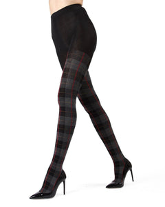 sweater knit tights in a black background plaid with grey, red, and ochre, shown on model