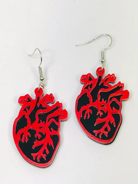 Black and red laser cut acrylic anatomical heart dangle earrings.
