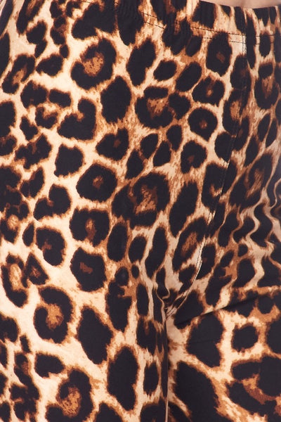 High-waisted super stretchy brushed fiber (soft like the skin of a peach!) leggings in a classic leopard print. Shown on a model up close to display detail in print