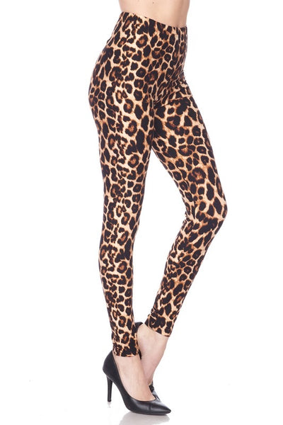 High-waisted super stretchy brushed fiber (soft like the skin of a peach!) leggings in a classic leopard print. Shown on a model from the side at a 3/4 angle