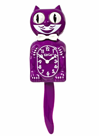 purple & white Kit-Cat wall mount clock features a mischievous grin, and big round eyes that swivel side-to-side in time with its pendulum tail 
