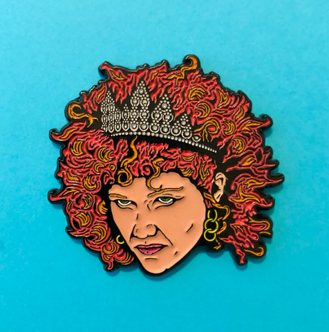 tiara-wearing head of The Cramps' Poison Ivy as glow-in-the-dark enameled black metal clutch back pin
