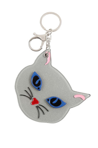 Glittery grey resin blue-eyed kitty face keychain that slides open to reveal a mirror