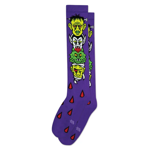 pair "Monster Mash" head stack of Mummy, Creature, Dracula, and Frankenstein's Monster on vibrant purple soft stretch cotton blend knee socks
