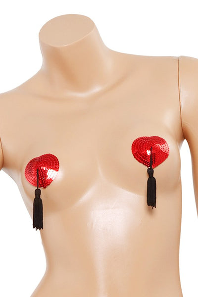 pair red sequin covered heart-shaped silicone pasties with black tassels, shown on mannequin torso